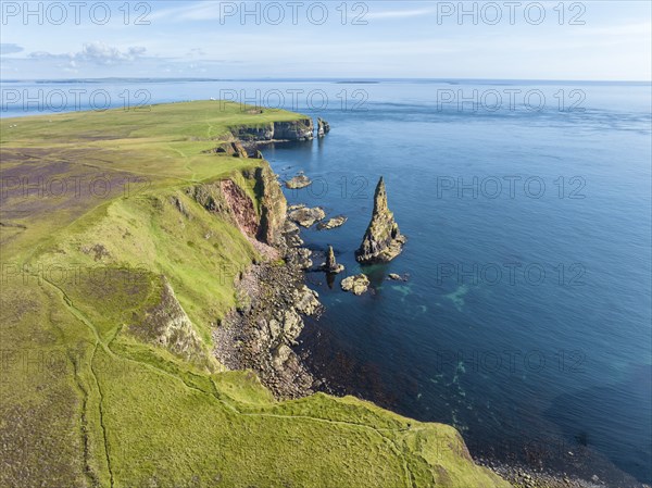 Aerial view of the rugged coastal landscape with the Duncansby Stacks, Duncansby Head coast, County