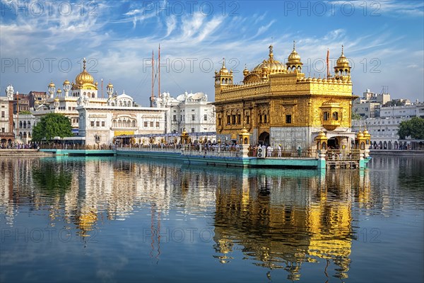 Sikh gurdwara Golden Temple (Harmandir Sahib) and water tank. Holy place of Sikihism. Amritsar,