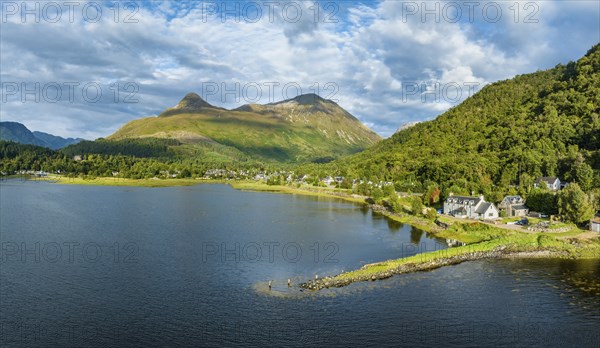 Aerial panorama of the freshwater loch Loch Leven with the former Pier House in the village of Glen