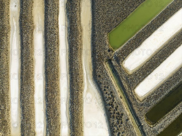 Saline ponds at the salt works near Chiclana de la Frontera. Aerial view. Drone shot. Cadiz