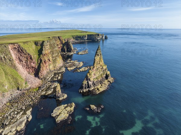 Aerial view of the rugged coastal landscape with the Duncansby Stacks, Duncansby Head coast, County