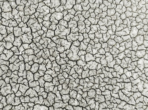 Cracked earth in the marshland near Sanlucar de Barrameda. Aerial view. Drone shot. Cadiz province,