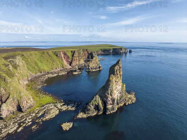 Aerial view of the rugged coastal landscape with the Duncansby Stacks, Duncansby Head coast, County