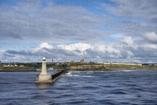 Tynemouth Lighthouse with the ruins of Tynemouth Priory and Castle behind, North Shields, Newcastle