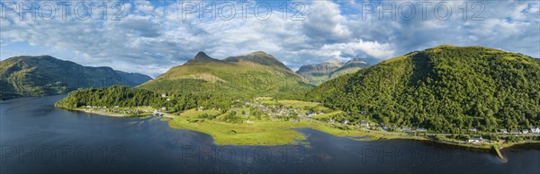 Aerial panorama of the freshwater loch Loch Leven with the village of Glen Coe, above it the 742