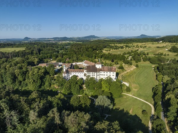 Aerial view of Langenstein Castle near Eigeltingen with surrounding golf course, on the horizon the