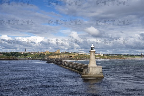 Tynemouth Lighthouse with the ruins of Tynemouth Priory and Castle behind, North Shields, Newcastle