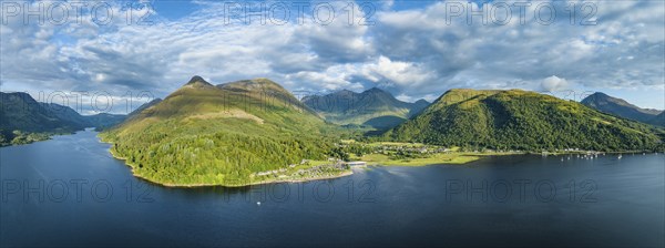 Aerial panorama of the freshwater loch Loch Leven with the village of Glen Coe, above it the 742
