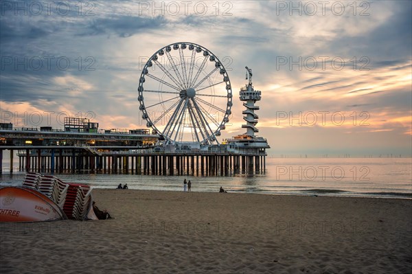 Ferris wheel at sunset on the pier at the beach, The Hague, Netherlands