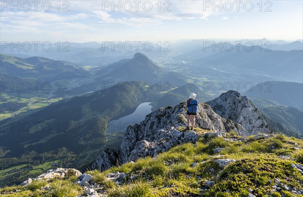 Hintersteiner Lake in the mountains, view from Schaffauer, hiker on a ridge in the mountains,