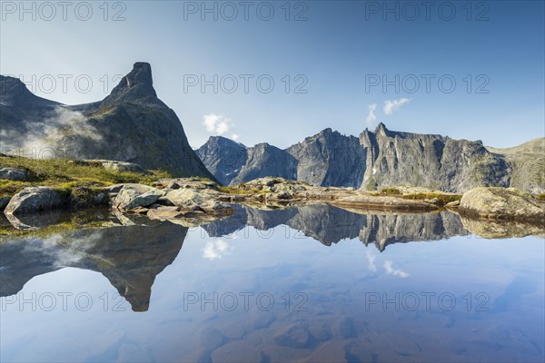 Romsdalshornet mountain reflected in mountain lake, Ã…ndalsnes, More og Romsdal, Norway, Europe