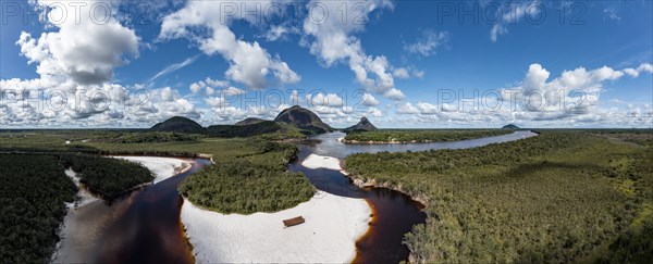 Black river and white sand beach before the granite hills, Cerros de Mavecure, Eastern Colombia