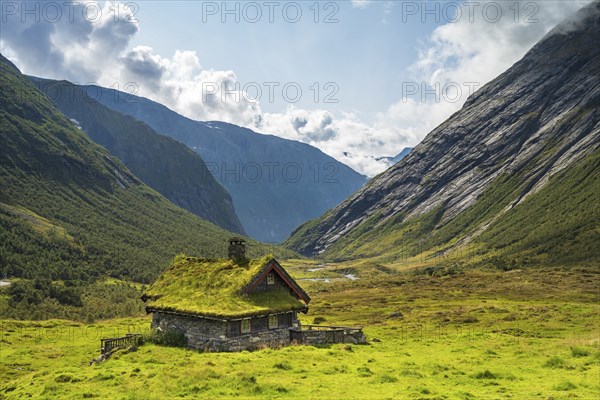 Traditional cottage with grass roof in mountain valley, Skjerdingsdalssaetra, Stryn, Norway, Europe