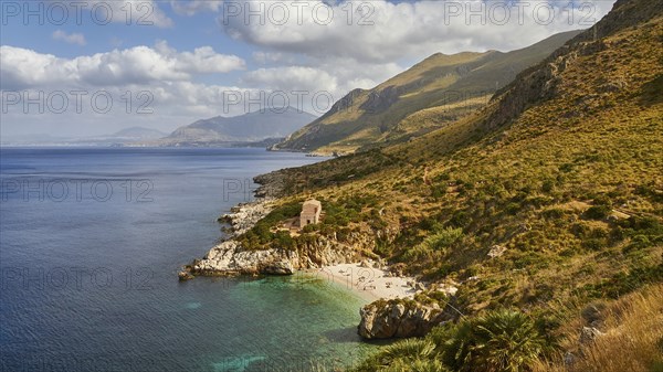 Cloudy weather, coastline, green coastal mountains, small bay, pebble beach, bathers, Zingaro,