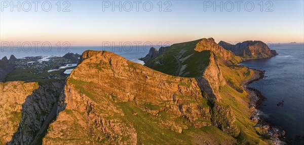 Coast and mountains in the evening light, Vaeroy Island, Vaeroy, Lofoten, Norway, Europe