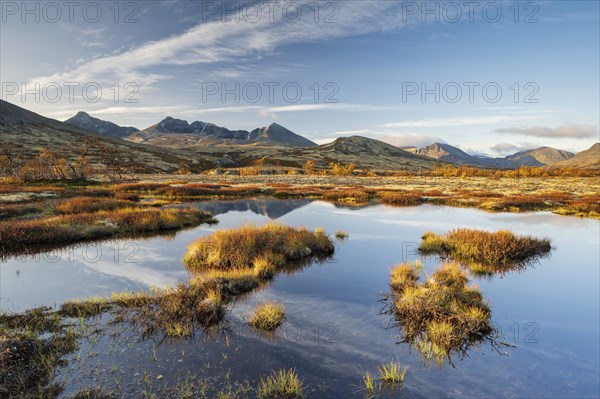 Autumn landscape in Rondane National Park, mountains Hogronden, Midtronden and Digerronden Doralen,