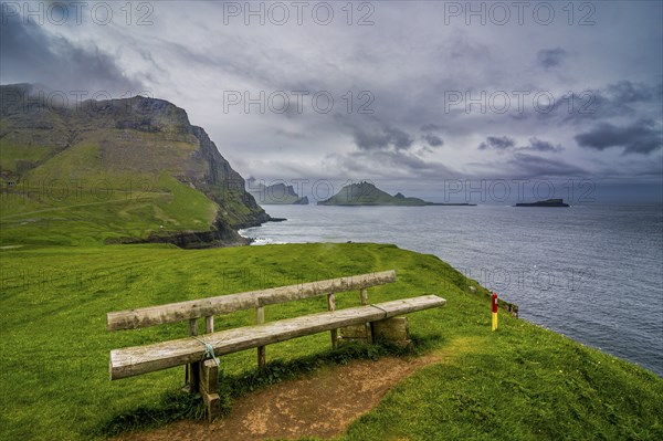 Bench overlooking over Gasadalur, Vagar, Faroe islands, Denmark, Europe