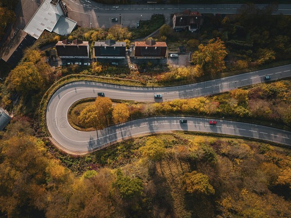 Aerial view S-curve in autumn, Calw, Black Forest Germany