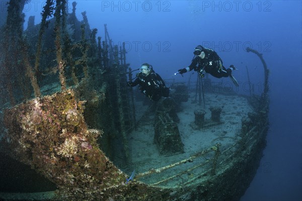 Divers at the stern of the Maldive Victory wreck, Hulhule, North Male Atoll, Maldives, Asia