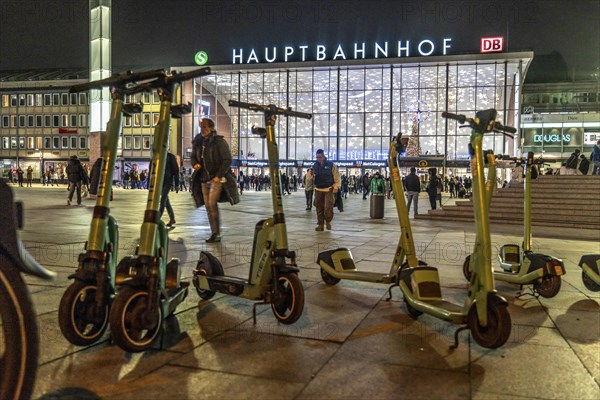 Cologne Central Station, station forecourt, evening, parked e-scooters, North Rhine-Westphalia,