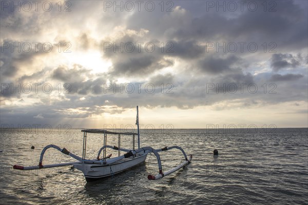 Jukung in the sea, typical landscape shot with a view of the horizon over the water, taken from a