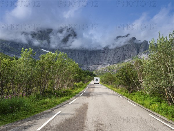 Steep granite cliffs at the road to Nusfjord, narrow single track road, Nusfjord, Flakstadoy,