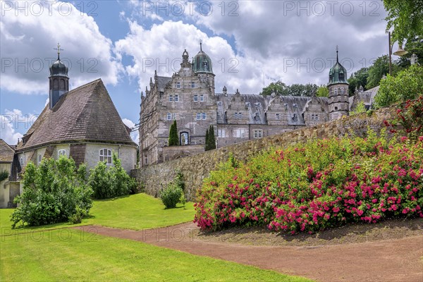 Garden with St. Mary's Castle Church and HÃ¤melschenburg Castle, Weser Renaissance castle,