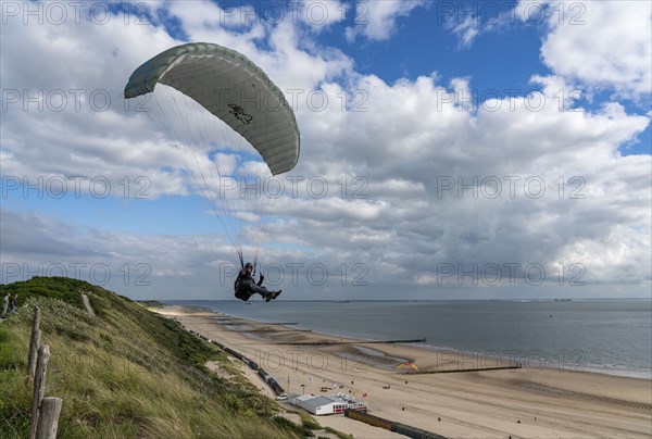 Paragliders along the dunes of Zoutelande, in Zeeland, South Holland, Netherlands