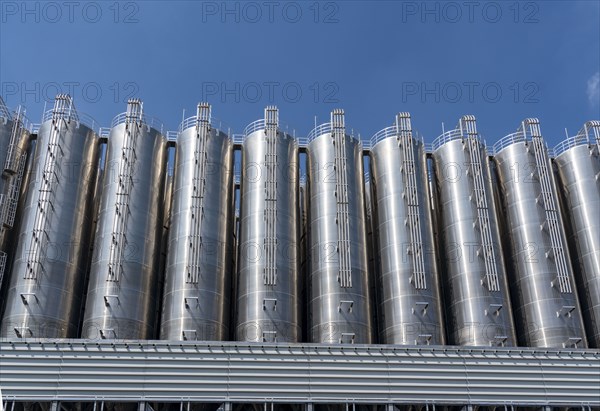 Stainless steel tanks of a large silo facility in Duisburg inland harbour, Duisburg-Neuenkamp, for