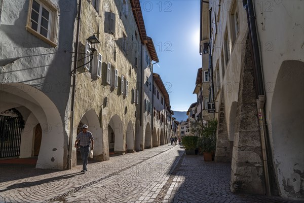 The town of Neumarkt, in the Adige Valley, in South Tyrol, arcades in the old town centre, in front