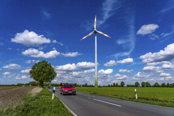 Wind turbine, wind energy plant from the manufacturer Enercon, blue sky with many white clouds,