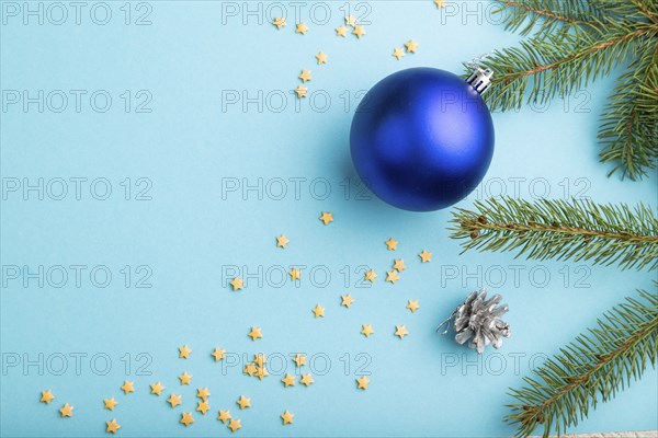 Christmas or New Year composition. Decorations, blue balls, cones, fir and spruce branches, on a