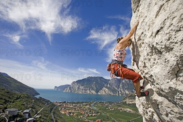 Young blonde fRau climbs on mountain, 35, years