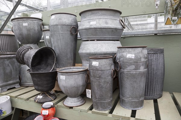 Display of metal planting containers, The Walled garden plant nursery, Benhall, Suffolk, England,