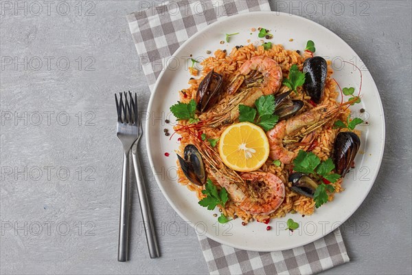 Seafood paella, shrimp and mussels risotto, rice, homemade, top view, no people