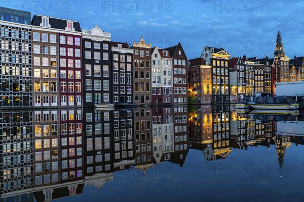 Canal houses on the Damrak, in the centre of the old town of Amsterdam, harbour, starting point of