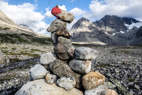 Cairn as signpost to glacier Lenangsbreen, at glacier lake Blavatnet, Blue water lake, Blavatn