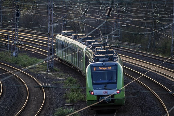 S-Bahn train on the tracks, railway layout, railway line west of the main station of Essen, North