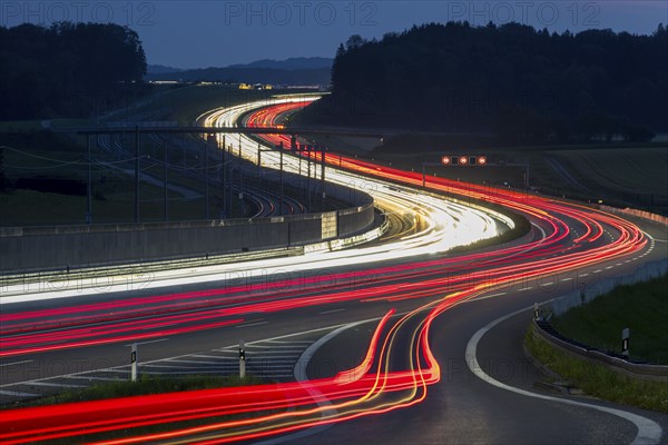 Tracers on the A8 motorway, winding road, evening, long exposure, Swabian Alb, Baden-Württemberg,