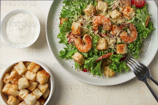 Caesar salad, with shrimp, on a white background, homemade, no people