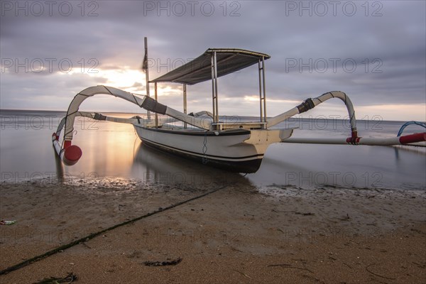 Jukung in the sea, typical landscape shot with a view of the horizon over the water, taken from a