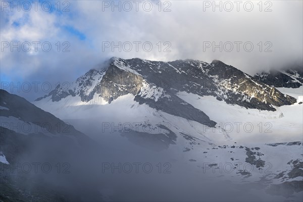 Cloudy glaciated summit Dosso Largo with glacier Schlegeiskees, Berliner Höhenweg, Zillertal Alps,