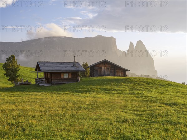 Alpine huts on the Seiser Alm in the last evening light, Schlern, South Tyrol, Trentino Alto Adige