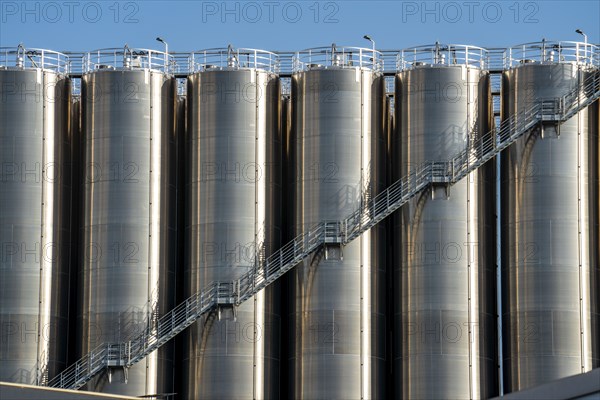 Stainless steel tanks of a large silo facility in Duisburg inland harbour, Duisburg-Neuenkamp, for