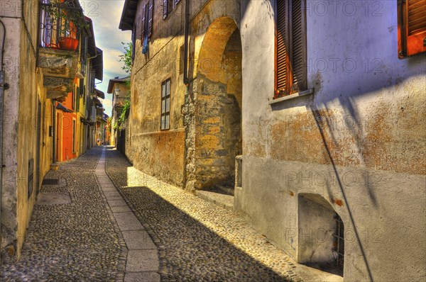 Old Beautiful Narrow Stone Alley in a Sunny Day in Cannobio, Piedmont, Italy, Europe