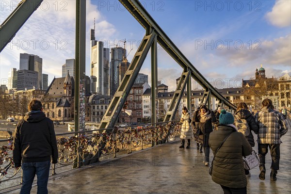 Skyline of the city centre of Frankfurt am Main, river Main, Eiserner Steg bridge, dusk, Hesse,