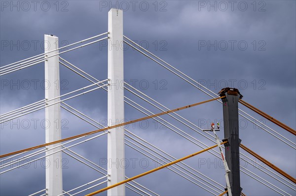The new Rhine bridge Neuenkamp, the A40, white pillar ropes, and the old motorway bridge, which is