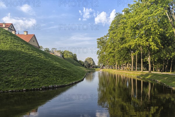 Ancient restored castle with a moat in the Nesvizh city. Belarus
