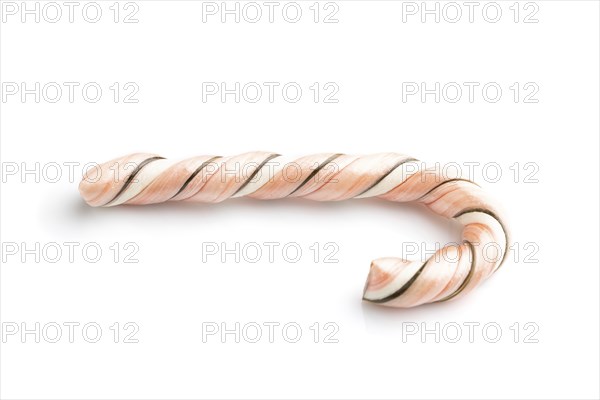 Single christmas cane candies isolated on white background. close up, side view