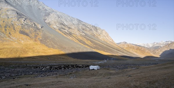 Barren landscape, mountain valley with yurt, Naryn province, Kyrgyzstan, Asia
